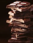 Stack of broken chocolate bars, close up shot — Stock Photo
