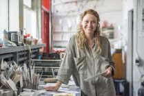 Portrait of female print designer in workshop — Stock Photo