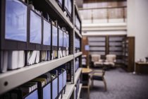 Rows of office shelves with files and paperwork — Stock Photo