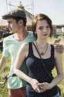 Portrait of young couple at funfair — Stock Photo