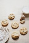 Hazelnut cookies and glass of cream — Stock Photo