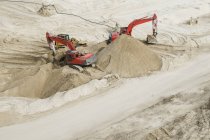 Aerial view of Excavators working in sand — Stock Photo