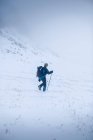 Hiker snow shoeing in rural landscape — Stock Photo