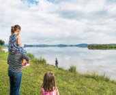 Grandmother carrying granddaughter on shoulders, Fuessen, Bavaria, Germany — Stock Photo