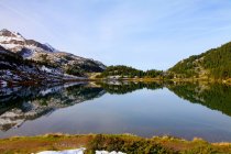 Landscape reflected in still lake — Stock Photo