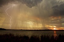Lightning storm over lake, Simonga, Livingstone, Zambia — Stock Photo