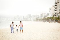 Three generation family enjoying beach, Rio de Janeiro, Brazil — Stock Photo