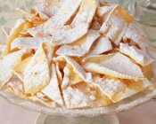 Traditional Italian party food, Chiacchiere, sweet crisp pastry — Stock Photo