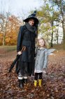 Mother and daughter in costumes — Stock Photo