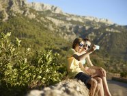 Brother and sister making faces for selfie on smartphone, Majorca, Spain — Stock Photo
