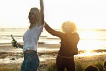 Mother and daughter partying on Bournemouth beach, Dorset, UK — Stock Photo