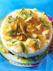 Close up shot of tapioca pudding decorated with flowers and mint leaves — Stock Photo