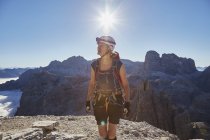 Female hiker arriving on Paternkofel mountain peak, Dolomites, Sexten, South Tyrol, Italy — Stock Photo