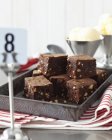 Baking tray with sliced chocolate brownies — Stock Photo