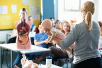 Lecturer speaking to college students in Childcare class — Stock Photo