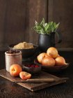 Apricots, cranberries, brown onions, demerara sugar and fresh sage — Stock Photo