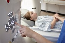 Elementary age girl going into CT scanner — Stock Photo