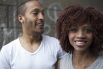 Portrait of young couple smiling — Stock Photo