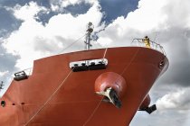 Low angle view of worker standing on board oil tanker — Stock Photo