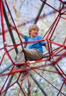 Boy climbing at playground — Stock Photo