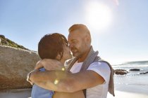 Mature couple hugging on beach, Cape Town, South Africa — Stock Photo