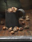 Noix de coco en métal vintage sur table bois — Photo de stock