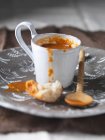 Mug with tomato soup — Stock Photo