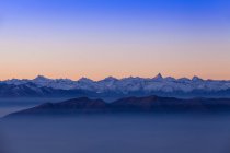 Elevated mountain landscape with valley mist at dawn, Monte Generoso,Ticino, Switzerland — Stock Photo