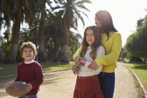 Mother, daughter and son in park — Stock Photo