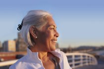 Close up profile of silver-haired mature woman — Stock Photo