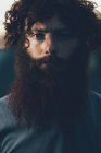 Portrait of staring, bearded young male hipster — Stock Photo