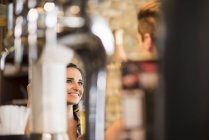 Young couple talking in bar — Stock Photo