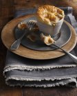 Smoked fish pie with spoon and fork on plate — Stock Photo