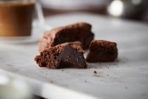 Chocolate brownies on wooden cutting board — Stock Photo