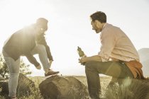Couple on rocks in field at daytime — Stock Photo