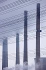 Coal power plant pipes and power lines — Stock Photo