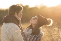 Young couple in rural setting, fooling around, face to face — Stock Photo