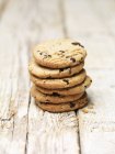 Stack of blueberry and oat cookies on wood — Stock Photo