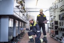 Workers testing for noise in electricity substation — Stock Photo