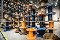 Many wire reels at distribution warehouse — Stock Photo