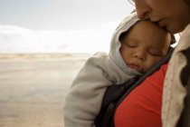 Mother with baby boy in sling — Stock Photo