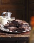 Stack of homemade chocolate brownies on plate — Stock Photo