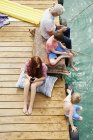 Family fishing on houseboat sun deck, Kraalbaai, South Africa — Stock Photo