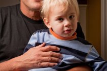 Father holding toddler son — Stock Photo