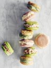 Top view of homemade macarons on marble surface — Stock Photo