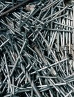 Full frame image of variety of nails and screws — Stock Photo