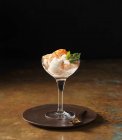Prawn cocktail in wine glass with coriander — Stock Photo