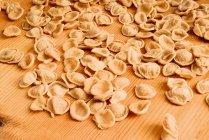 Fresh pasta on wooden board — Stock Photo
