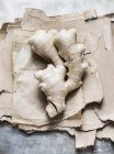 Top view of ginger root on brown paper — Stock Photo
