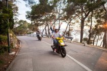 Two couples riding mopeds on rural road, Split, Dalmatia, Croatia — Stock Photo